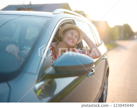 Traveler woman drives car through scenic countryside of Croatia Traveler woman drives car through scenic countryside of Croatia 123045040
