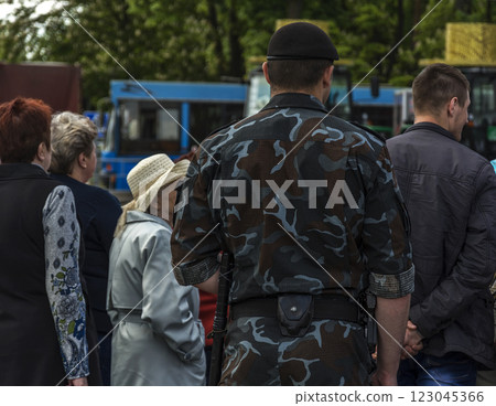 Belarus, Minsk - 05/27/2017 - The back of a man in uniform camouflage clothes and beret 123045366