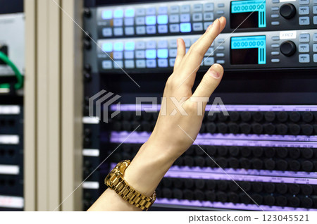 Female engineer working in a server room. Photo courtesy of Sky Perfect Tokyo Media Center. 123045521
