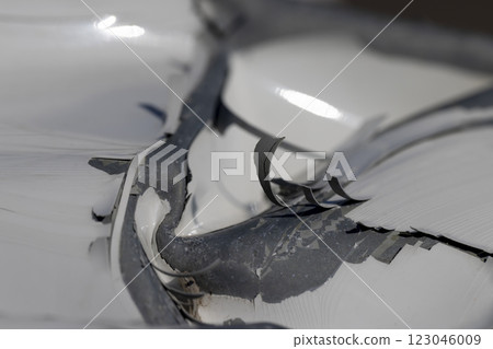 the part of the damaged car is white after the accident the part of the damaged car is white after the accident 123046009