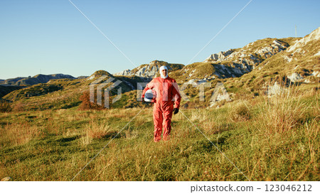 Astronaut Walks Lonely Among The Desolate Lands Of The New Planet 123046212