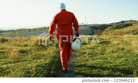 Astronaut Takes a Walk in the Meadows Before Leaving on the Space Mission 123046213