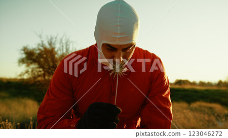 Astronaut Smells A Poisonous Flower And Slowly Suffocates And Crawl On Land 123046272