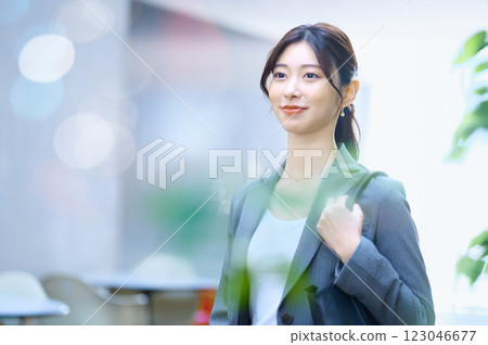A businesswoman in a suit going to work. Photo courtesy of Sky Perfect TV Tokyo Media Center. A businesswoman in a suit going to work. Photo courtesy of Sky Perfect TV Tokyo Media Center. 123046677