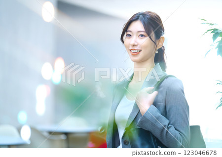 A businesswoman in a suit going to work. Photo courtesy of Sky Perfect TV Tokyo Media Center. 123046678