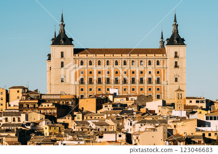 The majestic Alcazar of Toledo stands tall against a clear blue sky, showcasing its architectural grandeur. 123046683