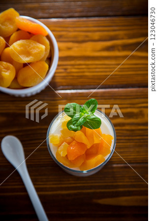 Diet breakfast with milk yogurt and dried apricots Diet breakfast with milk yogurt and dried apricots 123046730