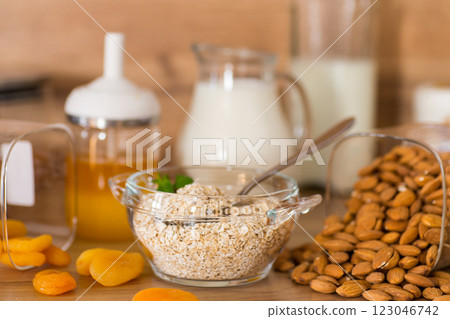bowl of oatmeal with dried fruits and nuts for breakfast 123046742