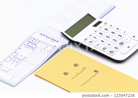 Image of pay envelope and calculator 123047226