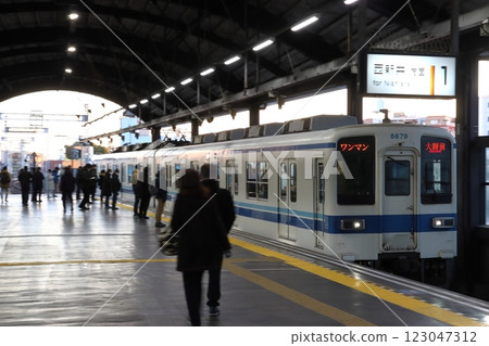 Tobu Daishi Line 8000 series train arriving at Daishimae Station on New Year's Day Tobu Daishi Line 8000 series train arriving at Daishimae Station on New Year's Day 123047312