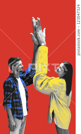 Man and woman raising oversized hands in synchronized high five, showing cooperation and shared agreement against red background. Man and woman raising oversized hands in synchronized high five, showing cooperation and shared agreement against red background. 123047324