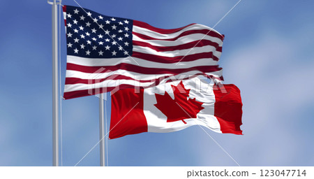 Canada and United States national flags waving in the wind 123047714