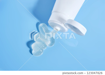 Gel toothpaste in a tube on a blue background. 123047826