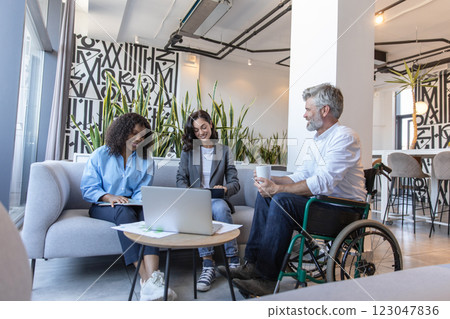 Businessman and managers working together on laptop integrating technology Businessman and managers working together on laptop integrating technology 123047836