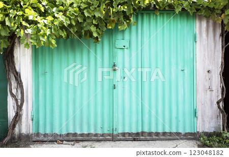 old metal warehouse door, hangar old metal warehouse door, hangar 123048182