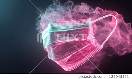 Neon pink medical face mask surrounded by smoke in dark atmosphere. 123048331