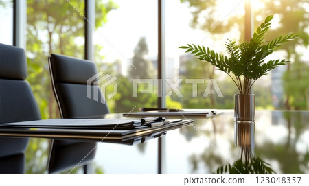 Sunlit modern conference room with greenery and glass table. 123048357