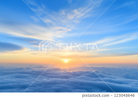 Sunrise over the clouds. View from the window of an airplane. 123048646