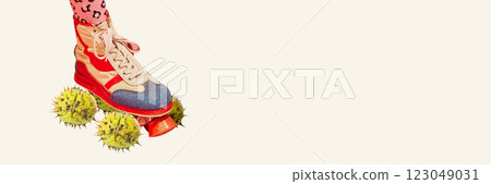 Banner. Surreal collage. Colorful sneaker rolling on spiky chestnuts against white background with copy space, blending sport with unexpected textures. Banner. Surreal collage. Colorful sneaker rolling on spiky chestnuts against white background with copy space, blending sport with unexpected textures. 123049031