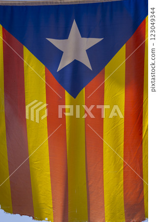Catalan flag hanging between houses 123049344