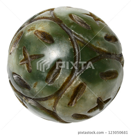 Ancient jade carved sphere with intricate patterns Ancient jade carved sphere with intricate patterns 123050681