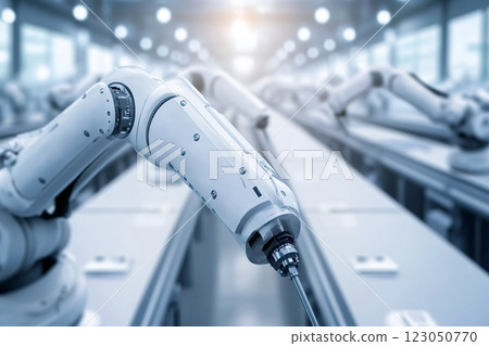 Robotic arms working on assembly line in modern factory 123050770