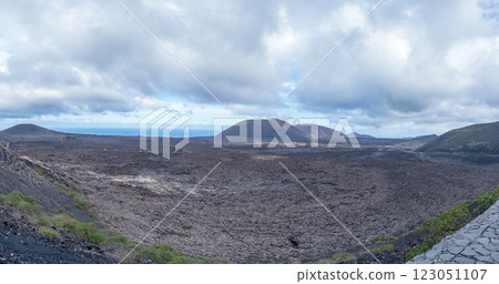 Volcanic Landscape Under a Cloudy Sky in Lanzarote Volcanic Landscape Under a Cloudy Sky in Lanzarote 123051107