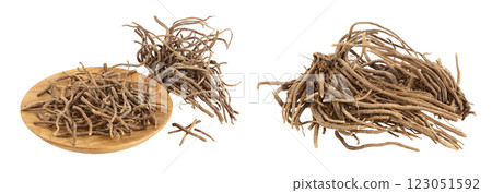 Dried Valerian root in wooden bowl isolated on white background. Valeriana officinalis with full depth of field. 123051592