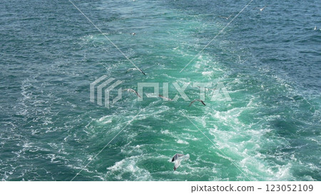 Ocean Wake Ship Trail: Sea, Vessel, Waves, turbulent water trail behind ship at sea, showing movement and speed. Ocean Wake Ship Trail: Sea, Vessel, Waves, turbulent water trail behind ship at sea, showing movement and speed. 123052109