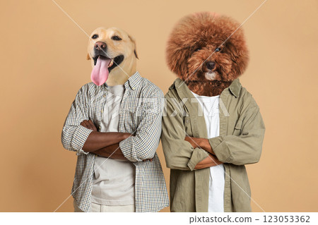 Two dogs with amusingly edited human bodies pose confidently with their arms crossed. The setting features a neutral background, enhancing their playful expressions and unique characterizations. Two dogs with amusingly edited human bodies pose confidently with their arms crossed. The setting features a neutral background, enhancing their playful expressions and unique characterizations. 123053362