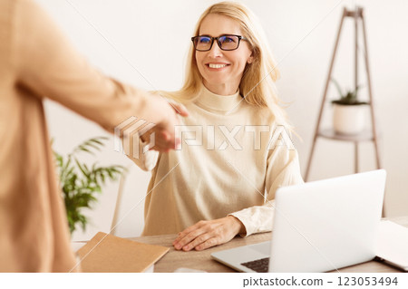 Successful Job Interview. Female Boss And Employee Handshaking In Office 123053494