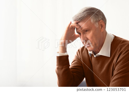 Stress. Depressed Senior Man Thinking About Problems Touching Head Sitting Against Window At Home. Selective Focus, Empty Space Stress. Depressed Senior Man Thinking About Problems Touching Head Sitting Against Window At Home. Selective Focus, Empty Space 123053701