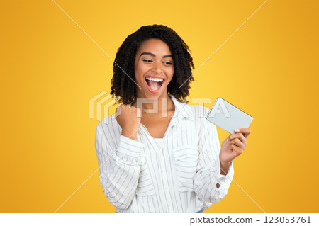 Easy Win, Jackpot. Happy black girl watching match on smartphone, celebrating goal, playing mobile games 123053761