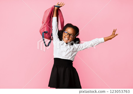 Back To School. Carefree African American Schoolgirl With Backpack Posing Over Yellow Background. Studio Shot 123053763
