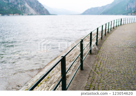 Lakeside Pathway with Metal Railings. 123054620