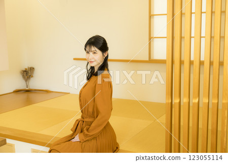 A woman relaxing in a Japanese-style room A woman relaxing in a Japanese-style room 123055114