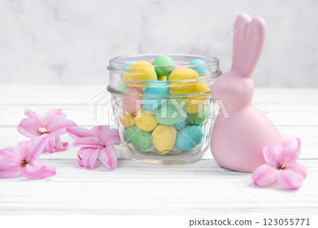Easter bunny, jar with sweet eggs and hyacinth flowers. Easter bunny, jar with sweet eggs and hyacinth flowers. 123055771