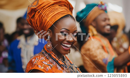 A woman wearing vibrant traditional clothing and accessories beams with joy while celebrating at a cultural gathering. A woman wearing vibrant traditional clothing and accessories beams with joy while celebrating at a cultural gathering. 123055893