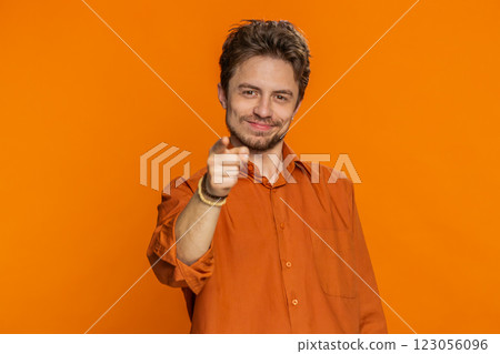 Happy Caucasian smiling man pointing finger to camera making winner choice showing direction, select Happy Caucasian smiling man pointing finger to camera making winner choice showing direction, select 123056096