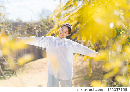 A young woman walking in the garden 123057166