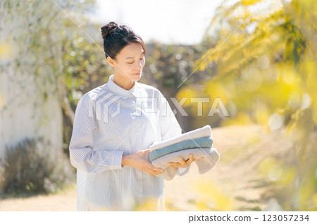 Woman with laundry Woman with laundry 123057234