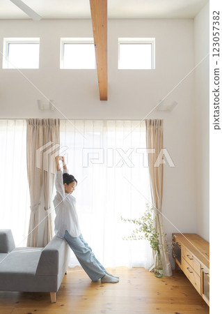 A woman relaxing in the living room 123057382