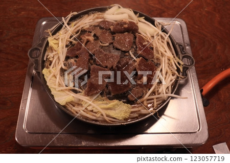 Genghis Khan grilled in a Genghis Khan pot 123057719