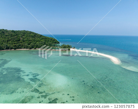 Curved sandy beach with crystal clear water and dense forest surrounding the shoreline. Ko Pha Ngan, Thailand. Curved sandy beach with crystal clear water and dense forest surrounding the shoreline. Ko Pha Ngan, Thailand. 123057875