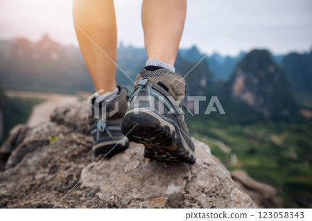 climbing to the top of mountain and enjoy baeautiful landscape of yangshuo county, China climbing to the top of mountain and enjoy baeautiful landscape of yangshuo county, China 123058343