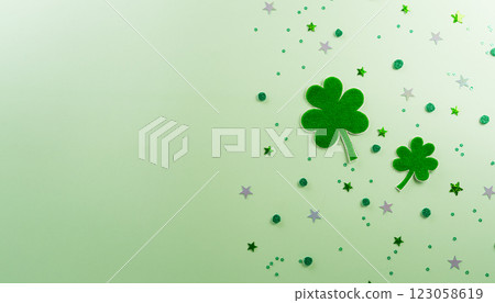 Happy St Patrick's Day decoration concept made from shamrocks ( clover leaf) on green pastel background. 123058619