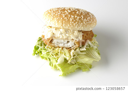 Tartar fish burger photographed on a white background (showing the inside) Tartar fish burger photographed on a white background (showing the inside) 123058657
