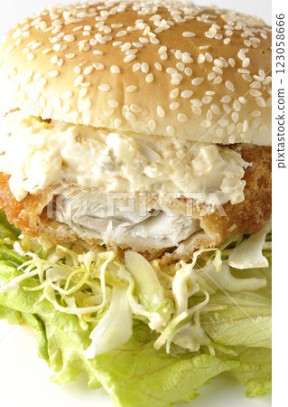 Tartar fish burger photographed on a white background (showing the inside) Tartar fish burger photographed on a white background (showing the inside) 123058666