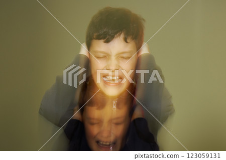 Teenager with psychological problem is screaming holding his ears. Teenager with psychological problem is screaming holding his ears. 123059131
