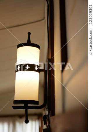 The lamps in the corridor of a retro Western-style building are on. The lamps in the corridor of a retro Western-style building are on. 123059361